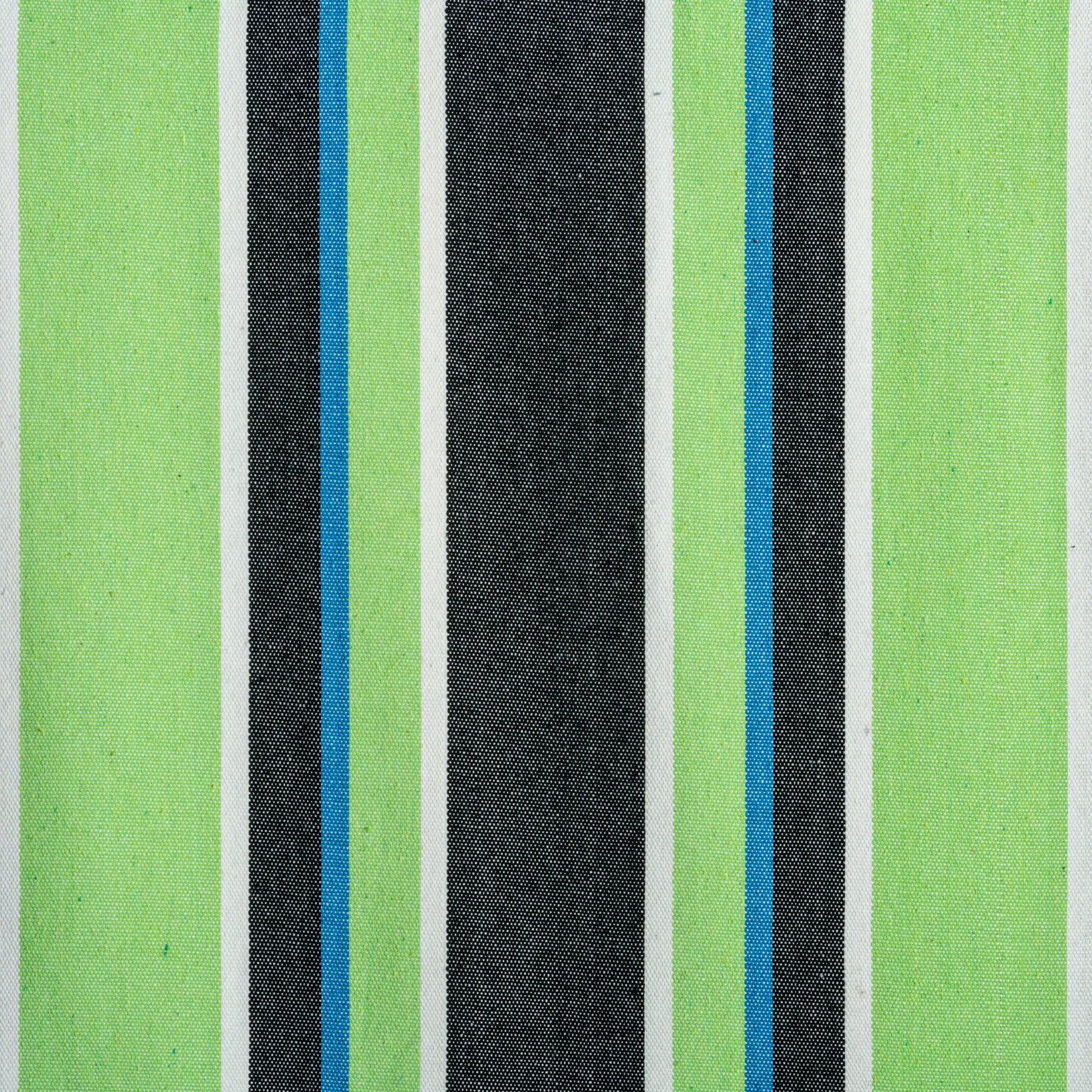 Close-up of the fabric and pattern showing the light green, blue, black, and white stripes.
