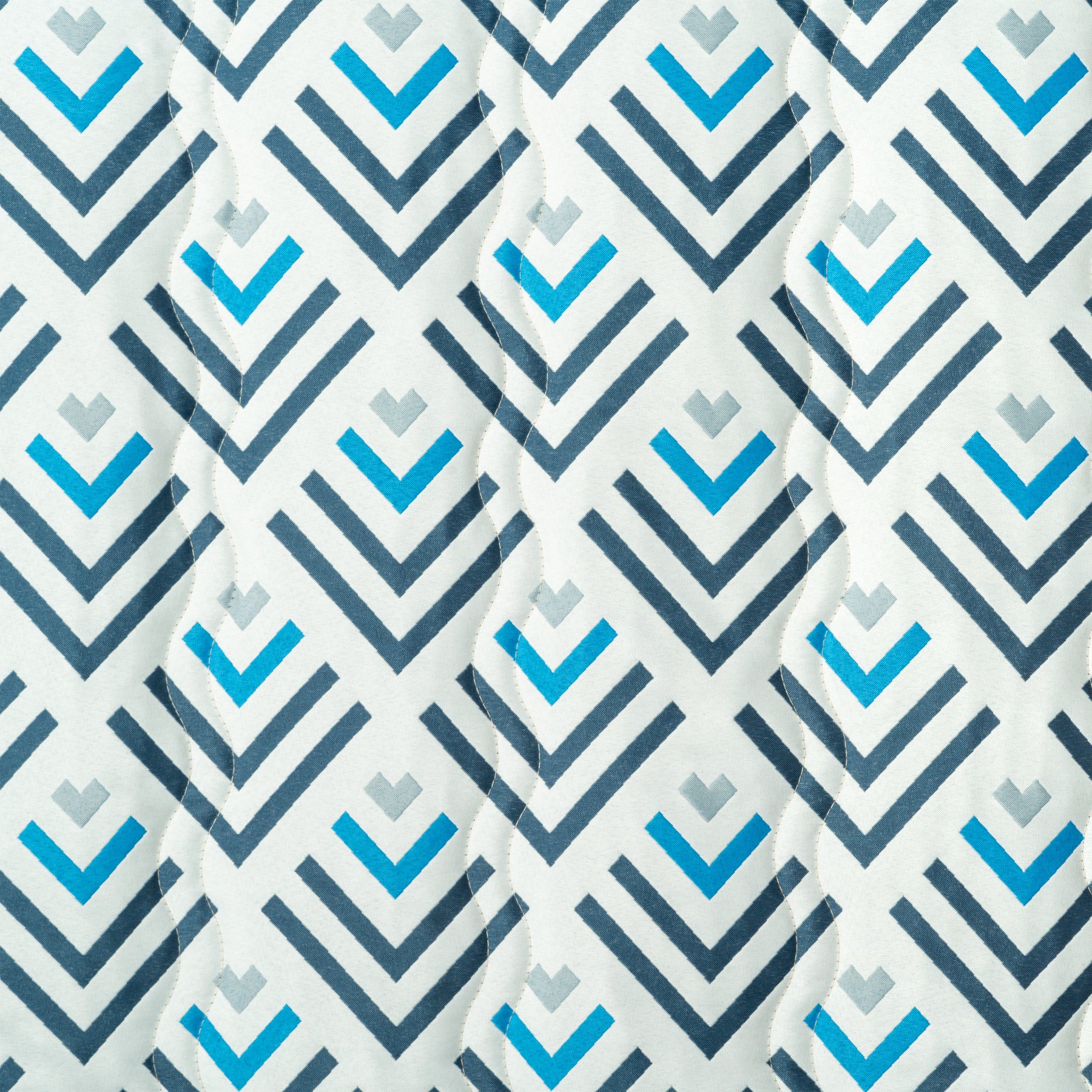 Close up of the fabric and pattern for the Bliss Hammocks 55-inch Wide 2-Person Reversible Quilted Hammock in the blue geo diamond variation.