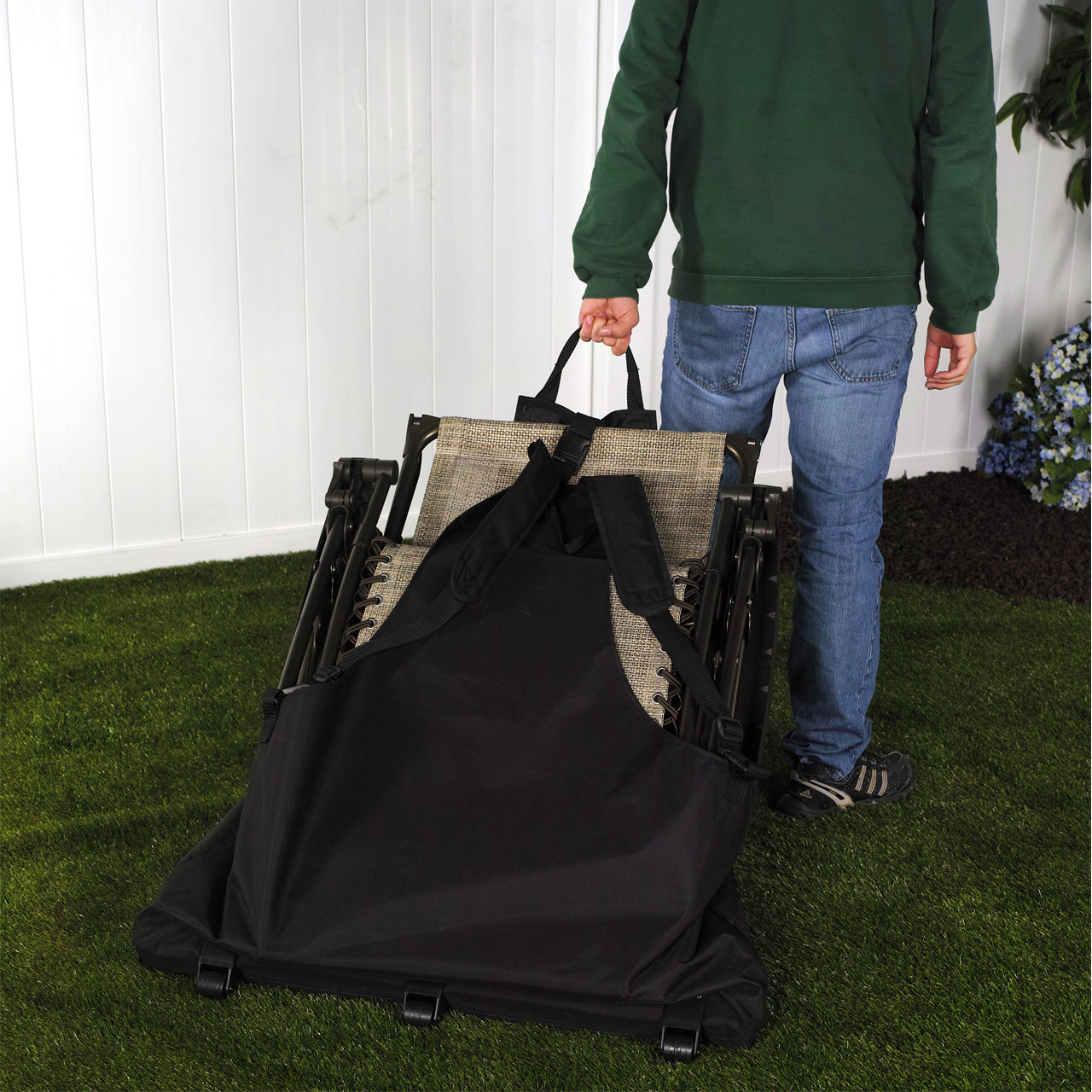 Person using the Bliss Hammocks Gravity Free Chair Carrying Backpack Bag to carry and move their Gravity Free Chair.