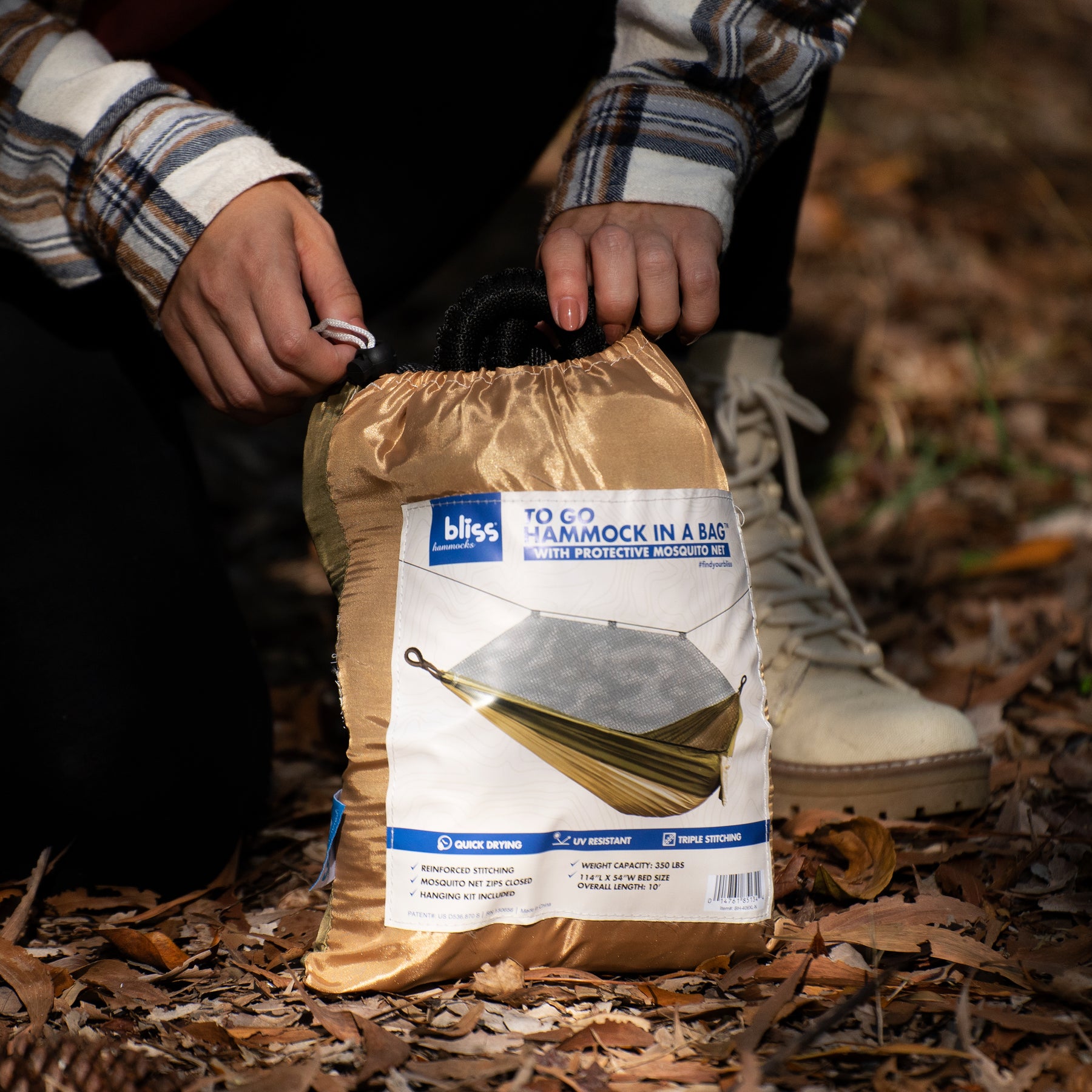 Person opening the Bliss Hammock in a Bag to take the hammock out.