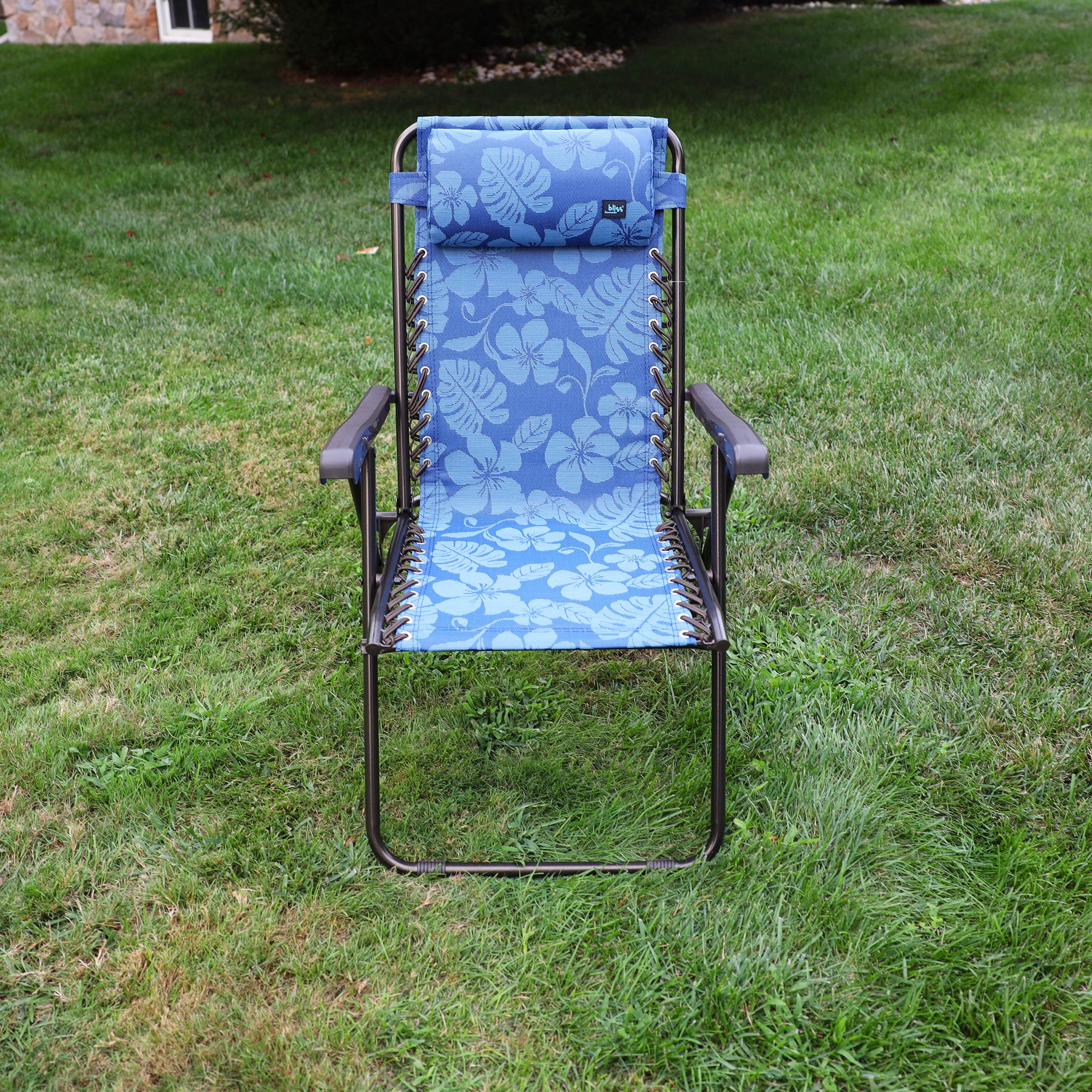 Front view of the 26-inch Blue Flower Reclining Sling Chair on a lawn.
