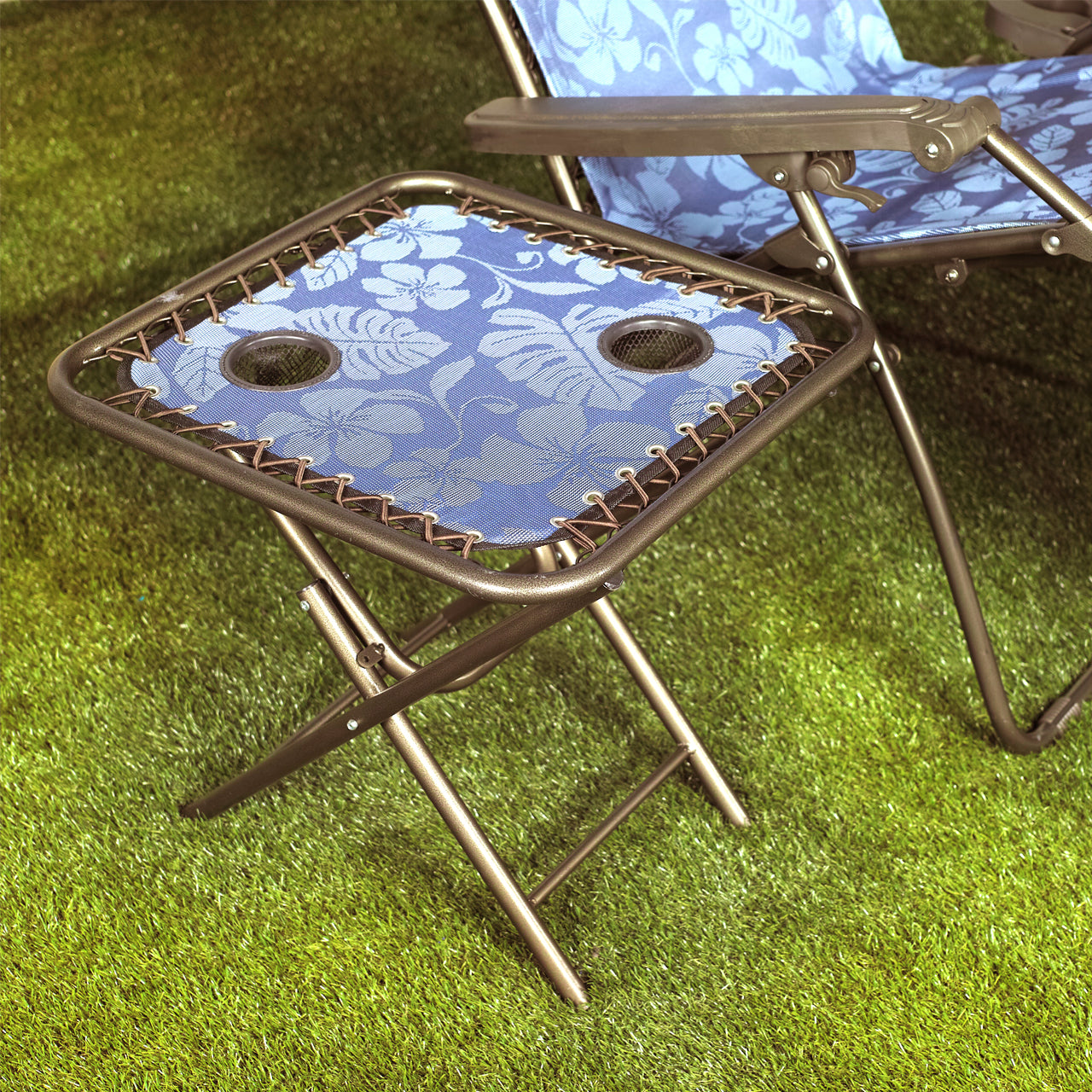 Bliss Hammocks 20-inch Folding Side Table with 2 Cup Holders in the grass next to a gravity free chair.
