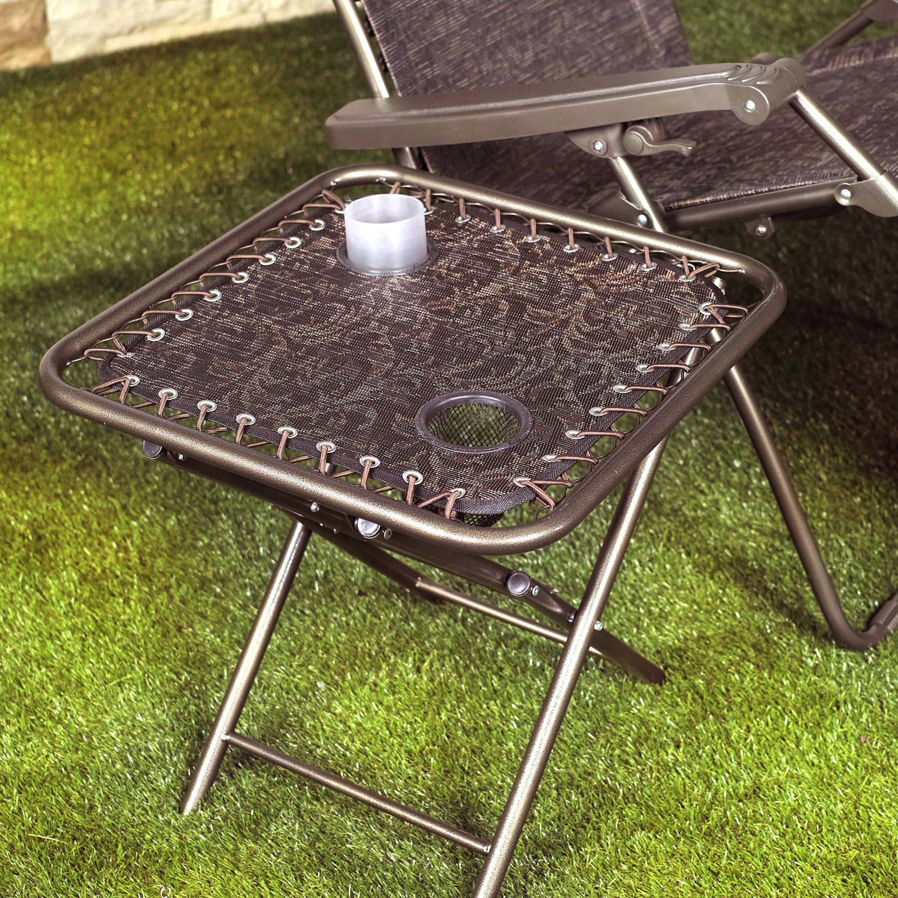 Bliss Hammocks 20-inch Folding Side Table with 2 Built-In Cup Holders in the brown jacquard variation with a cup in one of the holders.