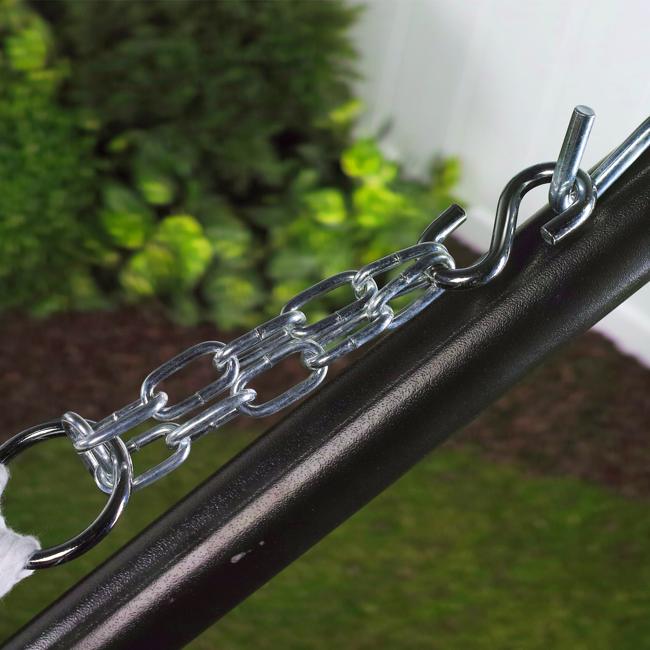 S Hook attached to a hammock stand, holding a hammock.