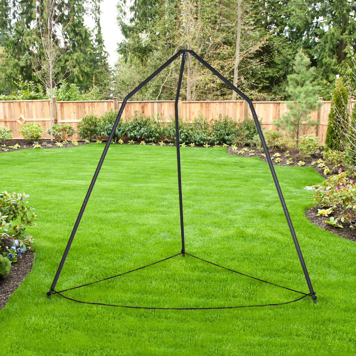 Bliss Hammocks 96-inch Overhead Tripod Stand with Supporting Base Ropes outside in a yard.