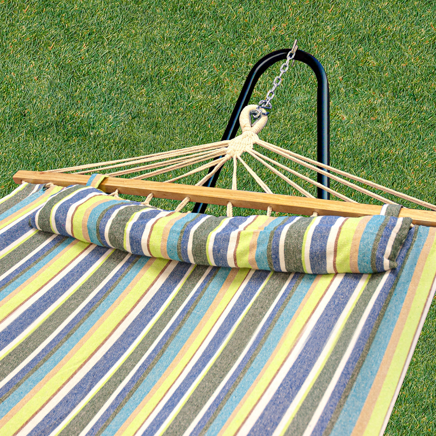 Close up of a hammock by Bliss Hammocks. It is shown connected to a hammock stand on grass - Hammock Accessories