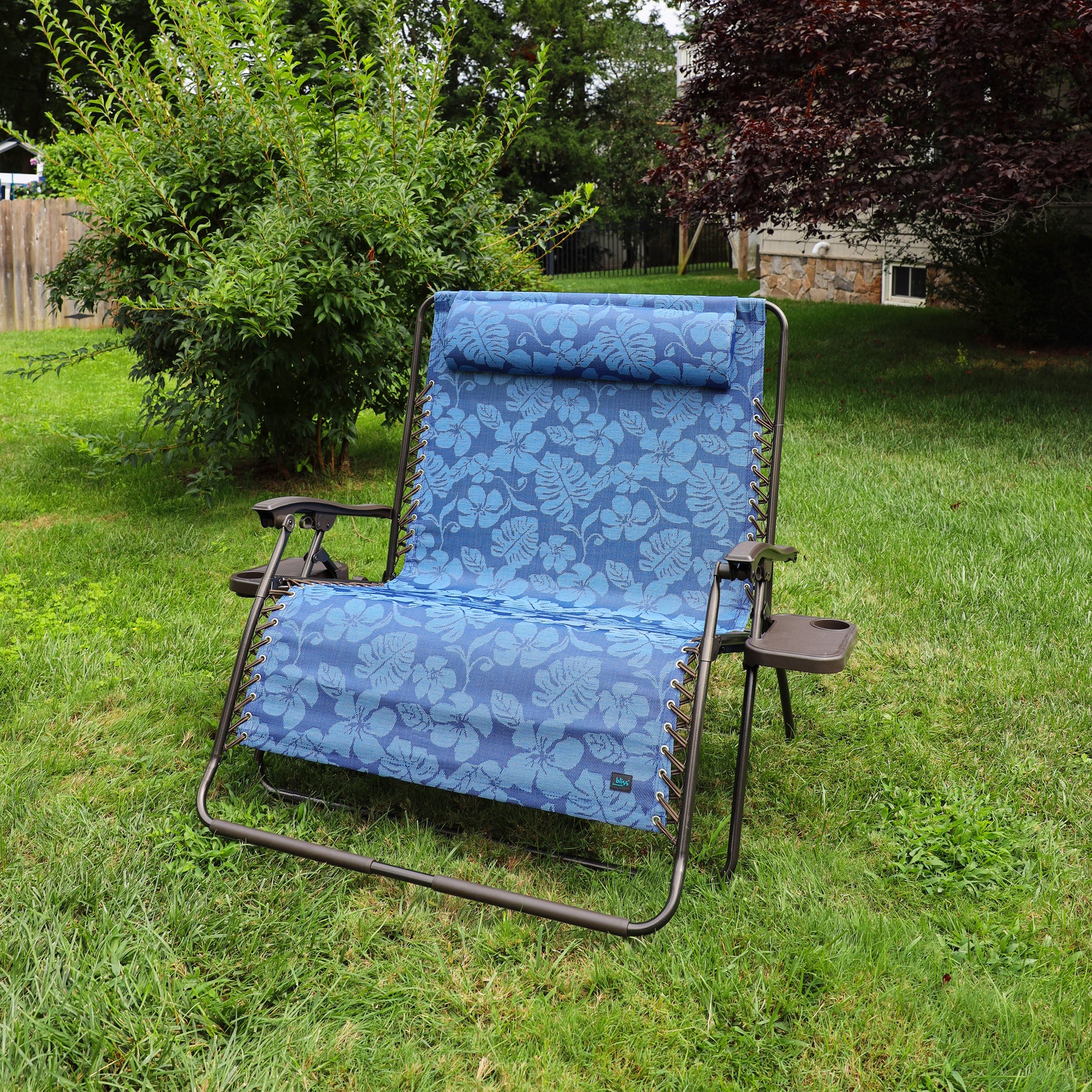 45-inch 2-Person Blue Flower Zero Gravity Chair on a lawn.