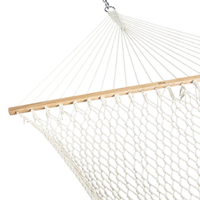 Close-up of one end of the hammock, showing the spreader bar and rope.