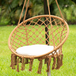 Bliss Hammocks 31.5-inch Wide Brown Macramé Swing Chair outside hanging from a stand.