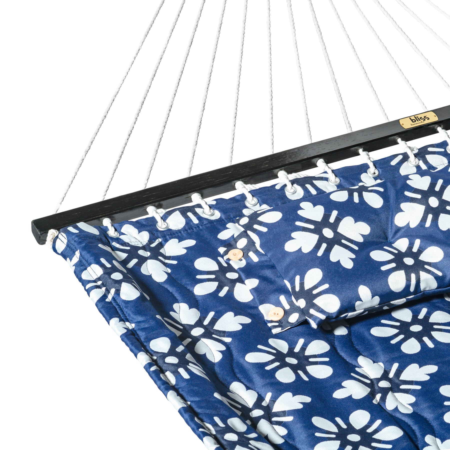 Close-up of the fabric and spreader bar for the Bliss Hammocks 55-inch Wide 2-Person Reversible Quilted Hammock with Spreader Bars and Pillow in the blue flowers variation.