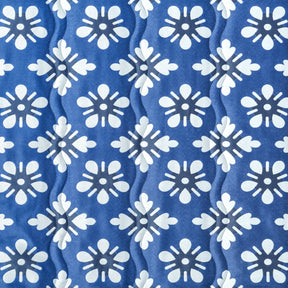 Close up of the fabric and pattern for the Bliss Hammocks 55-inch Wide 2-Person Reversible Quilted Hammock in the blue flowers variation.