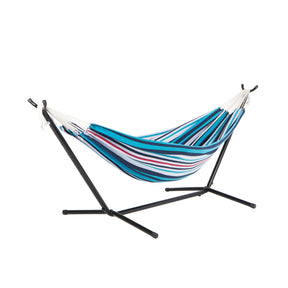 Bliss Hammocks 60-inch Wide Hammock & Built-in Stand in the Americas Cup Variation, which is mostly shades of blue stripes, with some white and red stripes.