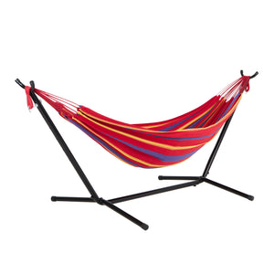 Bliss Hammocks 60-inch Wide Hammock & Built-in Stand in the Tequila Sunrise variation, which is mostly red with some yellow and purple stripes.