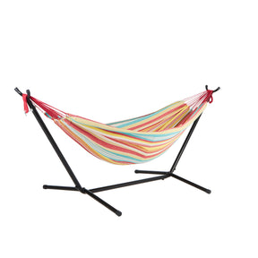 Bliss Hammocks 60-inch Wide Hammock & Built-in Stand in the Watermelon Stripe variation, which are stripes of red, yellow, white, and blue.