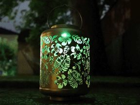 Bliss Outdoors 12-inch Tall Hanging and Tabletop Decorative Solar LED Lantern with Unique Tropical Flower Design and Antique Hand Painted Finish transitioning between the different color settings.