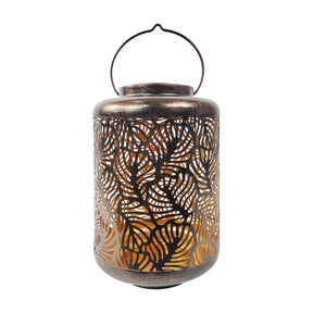 Bliss Outdoors 12-inch Tall Hanging and Tabletop Decorative Solar LED Lantern with Unique Tropical Leaf Design and Antique Hand Painted Finish in the brushed bronze variation.