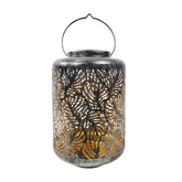 Bliss Outdoors 12-inch Tall Hanging and Tabletop Decorative Solar LED Lantern with Unique Tropical Leaf Design and Antique Hand Painted Finish in the brushed silver variation.