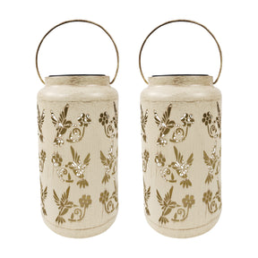 Bliss Outdoors 9-inch Tall 2-Pack Hanging and Tabletop Decorative Solar LED Lantern with Unique Humming Bird Design and Antique Hand Painted Finish in the antique white variation.