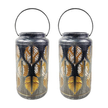 Bliss Outdoors 9-inch Tall 2-Pack Hanging and Tabletop Decorative Solar LED Lantern with Unique Tropical Leaf Design and Antique Hand Painted Finish in the brushed silver variation.