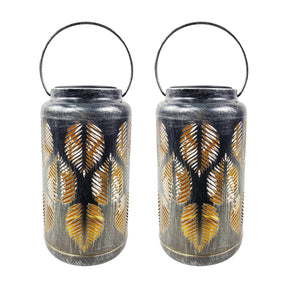 Bliss Outdoors 9-inch Tall 2-Pack Hanging and Tabletop Decorative Solar LED Lantern with Unique Tropical Leaf Design and Antique Hand Painted Finish in the brushed silver variation.