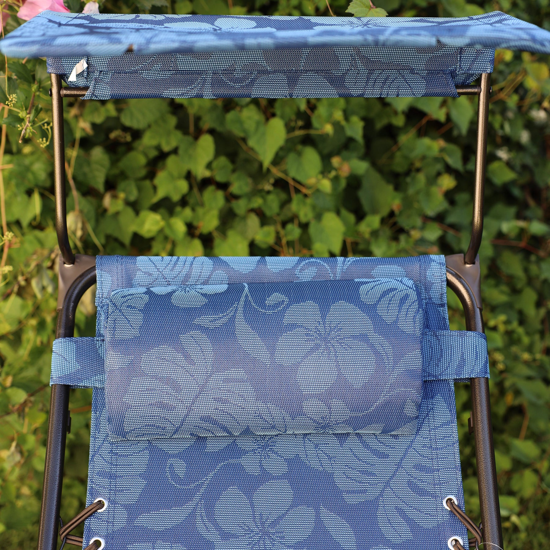 Close up of the pillow an canopy on the 26-inch Blue Flowers Zero Gravity Chair.