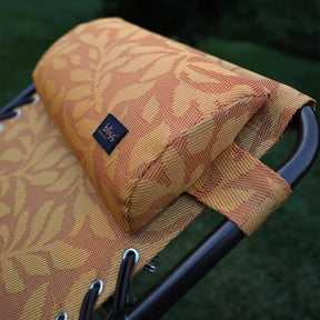 Close-up of the frame and pillow on the 26-inch Reclining Amber Leaf Sling Chair.