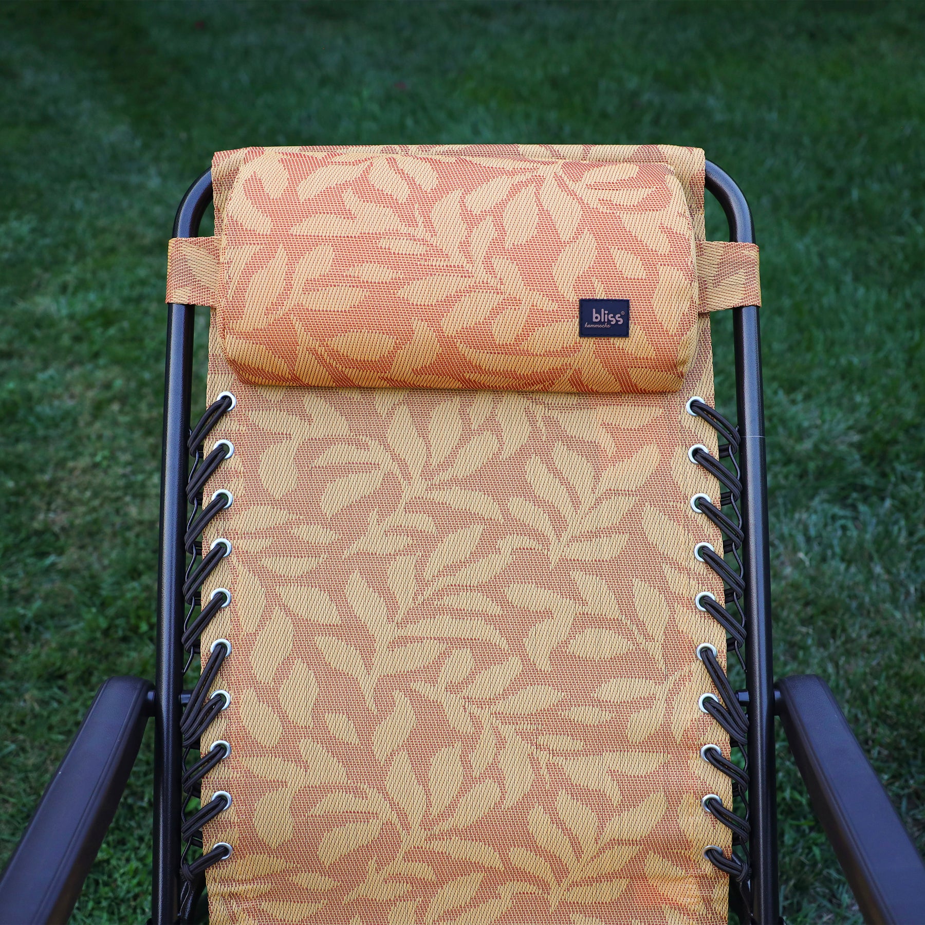 Close-up of the back rest and pillow on the 26-inch Reclining Amber Leaf Sling Chair.