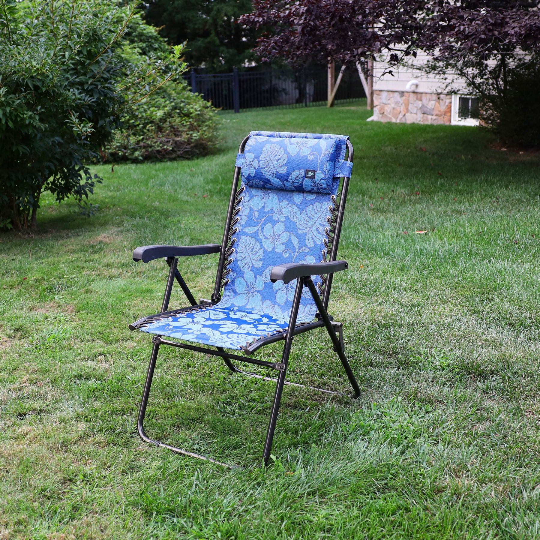 26-inch Reclining Blue Flower Sling Chair on a lawn.
