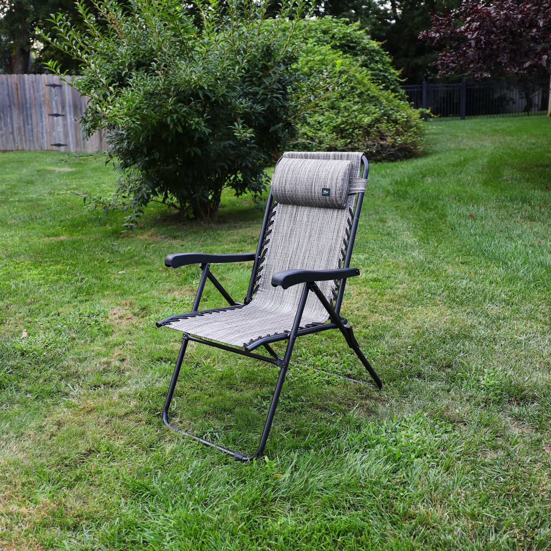 26-inch Reclining Platinum Sling Chair on a lawn.