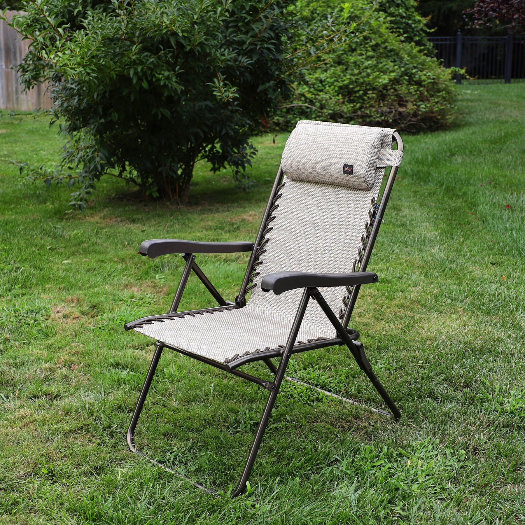 26-inch Reclining Sand Sling Chair on a lawn.