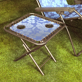 Bliss Hammocks 20-inch Folding Side Table with 2 Cup Holders in the grass next to a gravity free chair.