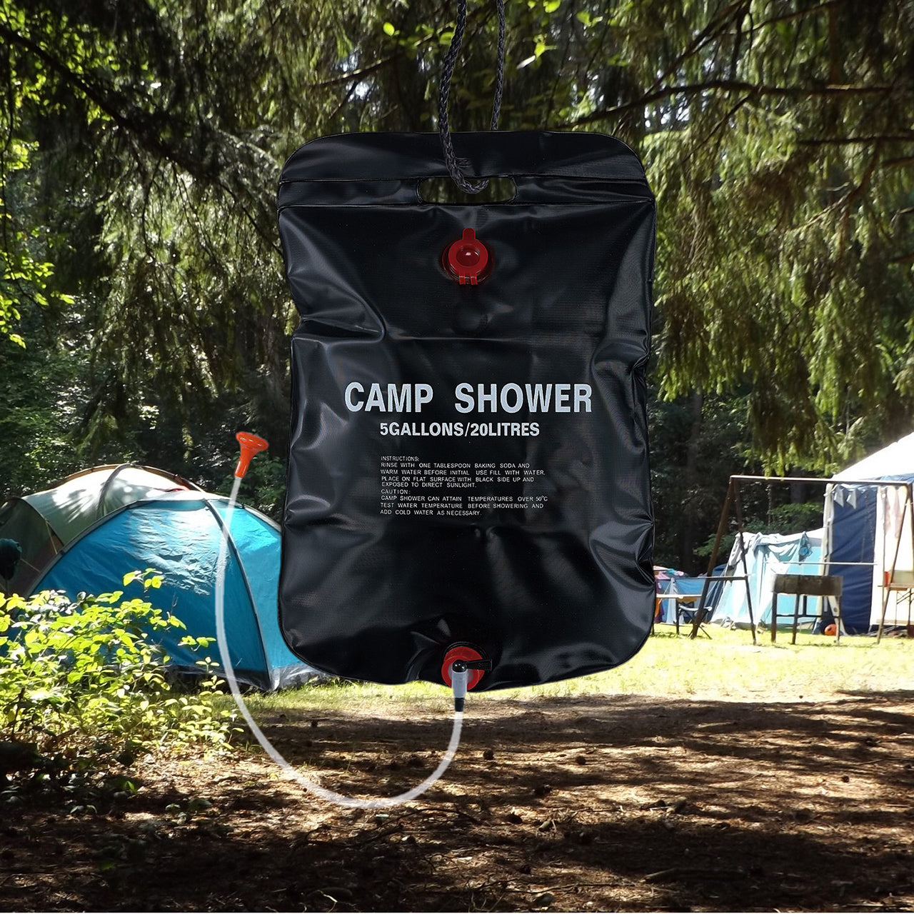 TrailGear 5 gallon Solar Shower Bag with Flexible Hose outside with a campsite in the background.